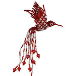 A handmade beaded hummingbird ornament, crafted with red and white seed beads, featuring a dotted pattern on the wings and a long, flowing tail of bead strands on a plain white background.