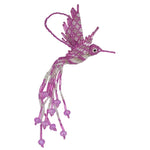 A pink and white beaded hummingbird ornament with dangling bead strands, photographed on a plain white background.