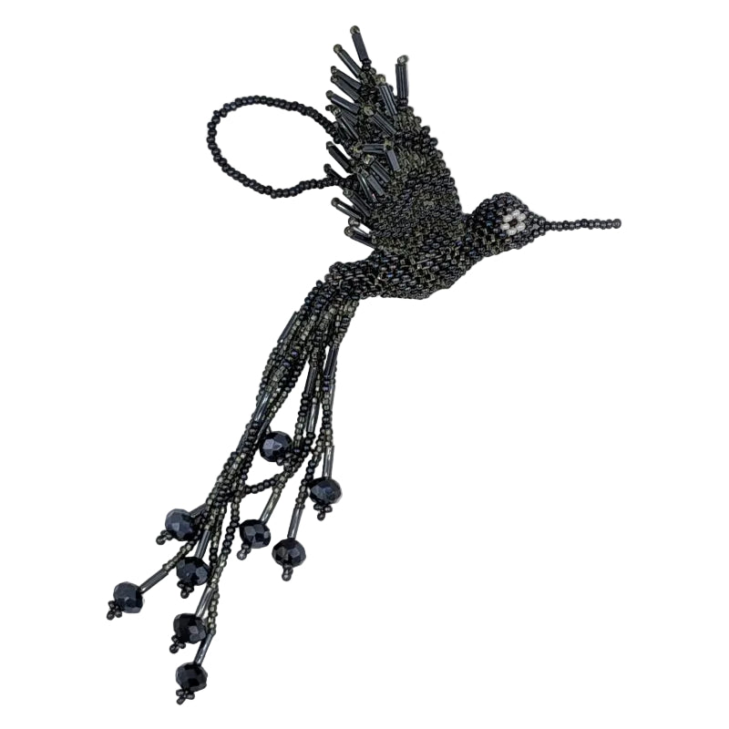 A beaded hummingbird ornament made from dark metallic gray glass seed beads, shown against a plain white background.