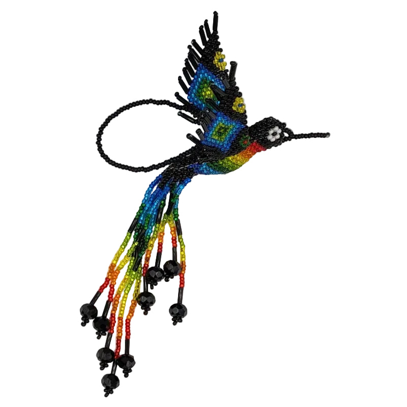 A colorful beaded hummingbird ornament with black seed beads and vibrant rainbow accents, photographed on a plain white background.
