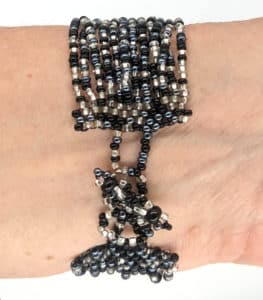Black, White, and Hematite Gray 12-Strand Beaded Bracelet